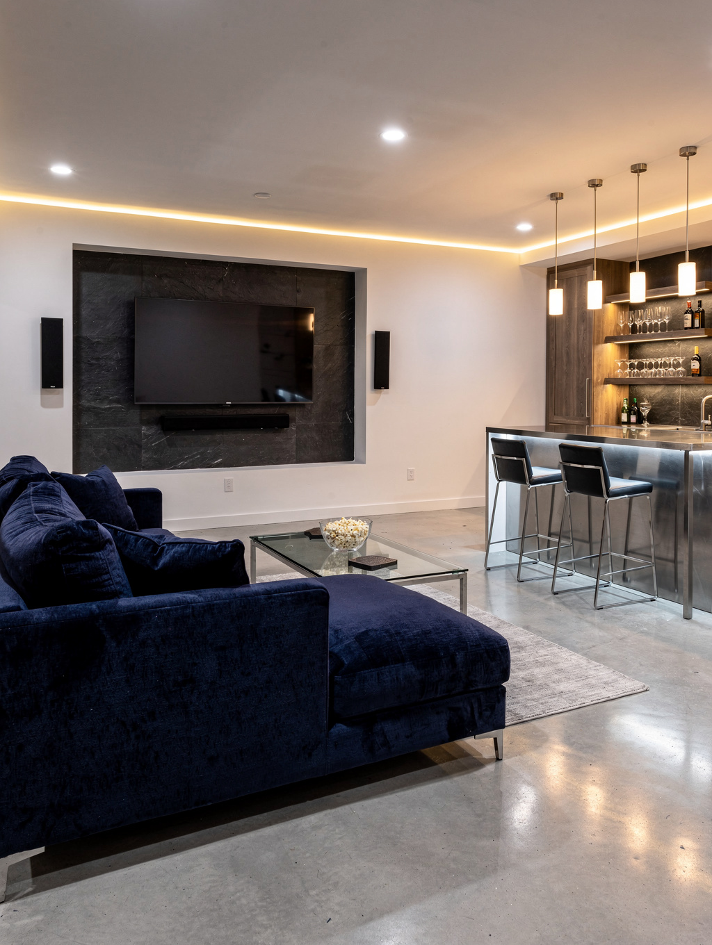 Custom finished terrace level basement in Dallas Georgia with wet bar media lounge and daylight walkout doors