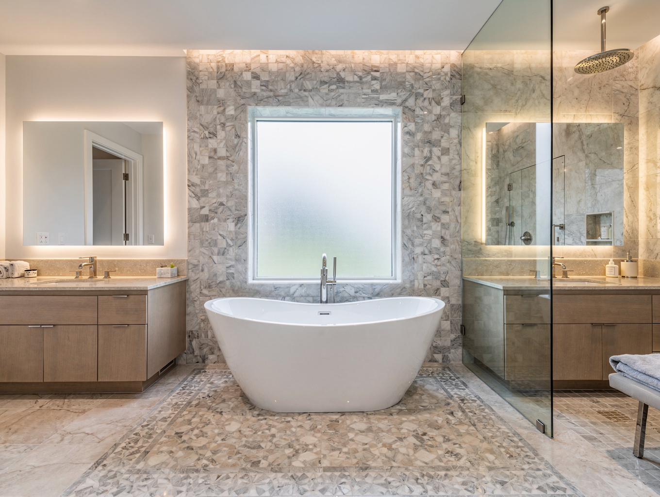 Renovated master bathroom with large frameless glass walk-in shower and freestanding soaking tub in a Hiram Georgia residence
