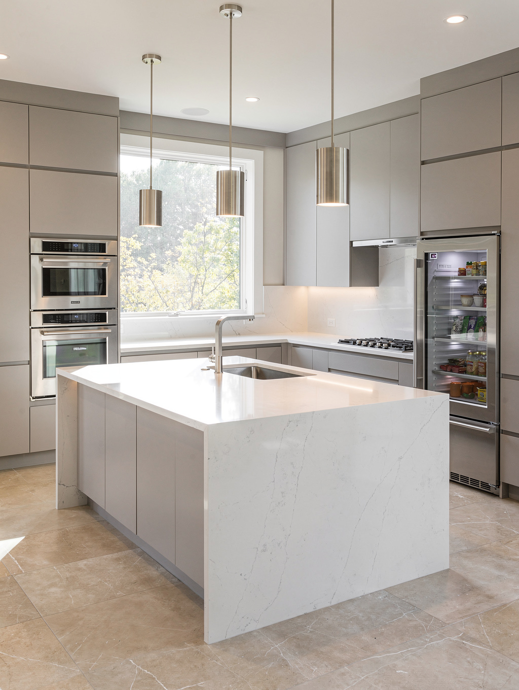 Bright, natural-light kitchen remodel in a Powder Springs Georgia home with quartz countertops and custom cabinetry