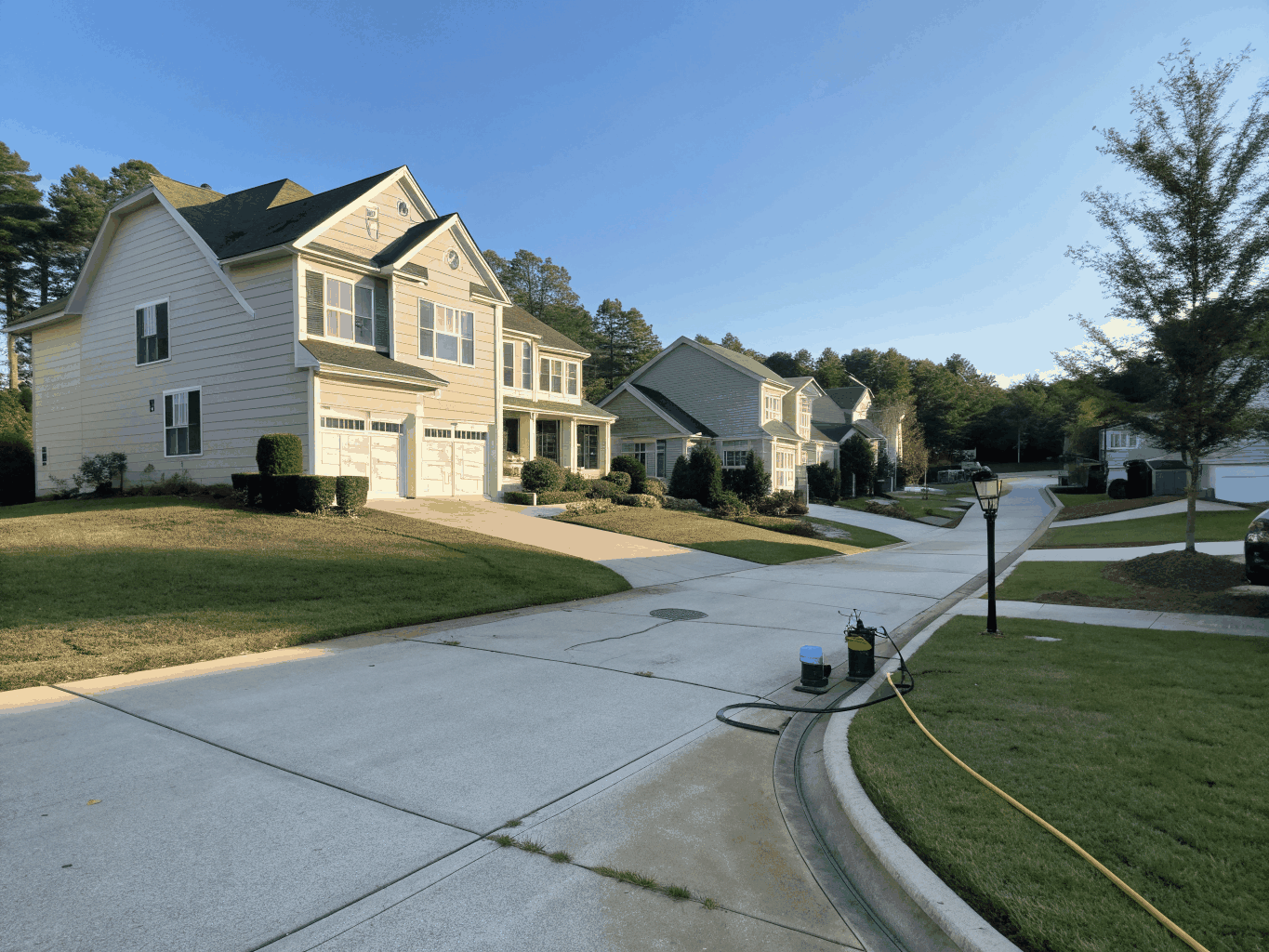 Natural light view of residential homes and tree lined street in Powder Springs Georgia
